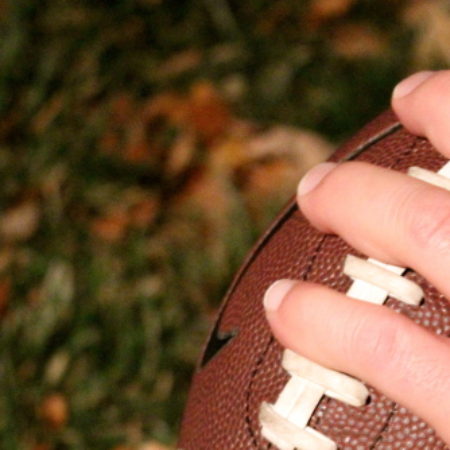 hand on football